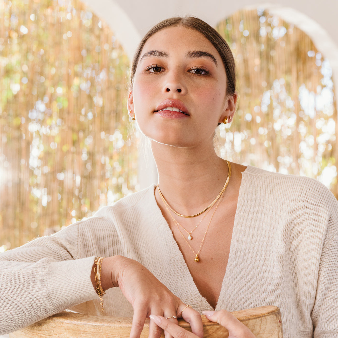 Small Large Teardrop Pendant Necklace Woman wearing an ivory sweater and jewelry. Necklaces: gold herringbone, opal, and teardrop necklace. Earrings: teardrop, and bead bar earrings